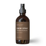 Applying natural lymphatic lotion to the legs with gentle massage for lymphatic drainage and circulation.