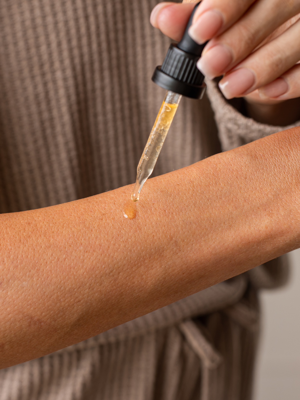 Applying Skin Rescue Drops to skin as a natural option for warts, skin tags, and other skin problems.