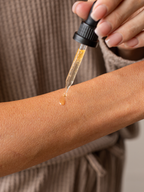 Applying Skin Rescue Drops to skin as a natural option for warts, skin tags, and other skin problems.