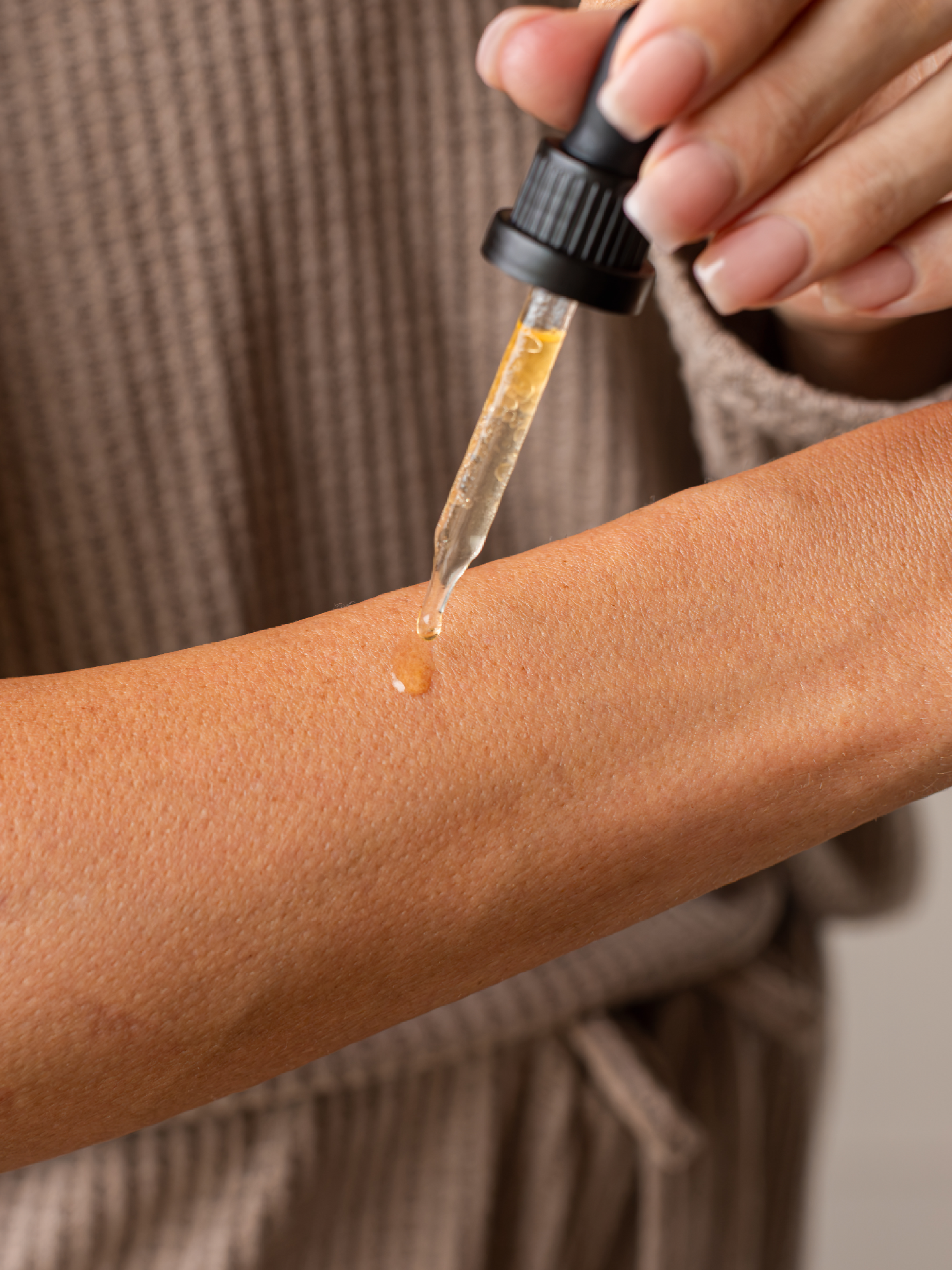 Applying Skin Rescue Drops to skin as a natural option for warts, skin tags, and other skin problems.