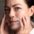 Using a gentle cream face cleanser to remove dirt, makeup, and sunscreen without drying out skin.